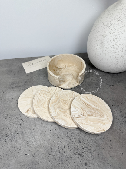 Set of stone coasters with a holder in beige marble.
