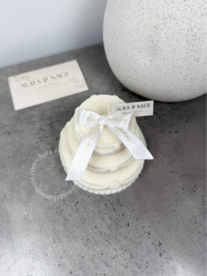 Tripled layer cake candle with white bow, birthday gift.