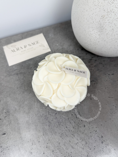 White candle ball with floral design.