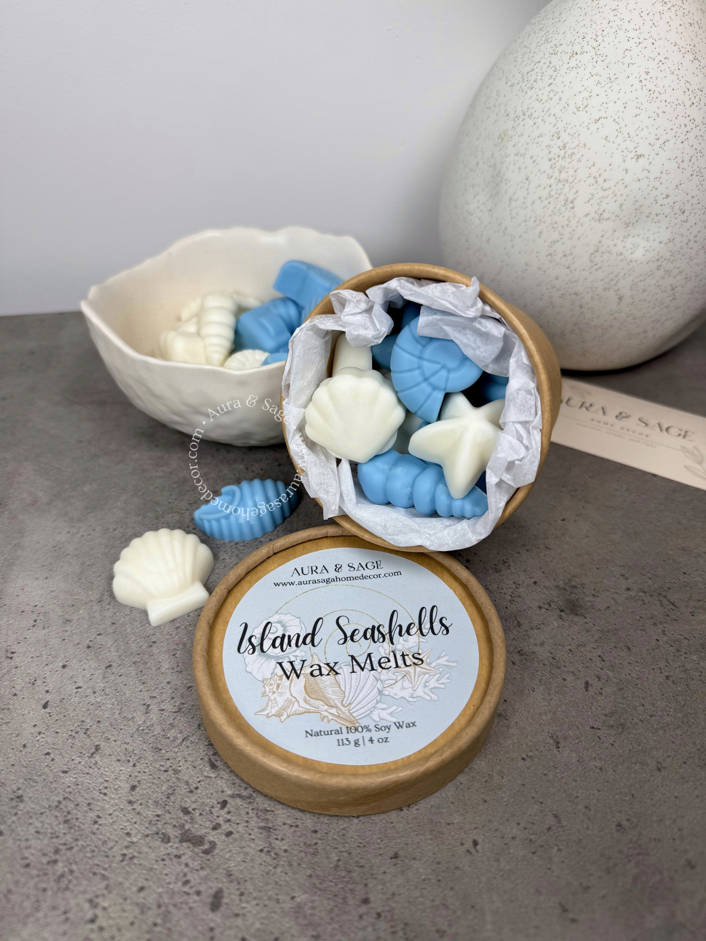 Island Seashells Wax Melts in a recyclable  container on a grey surface