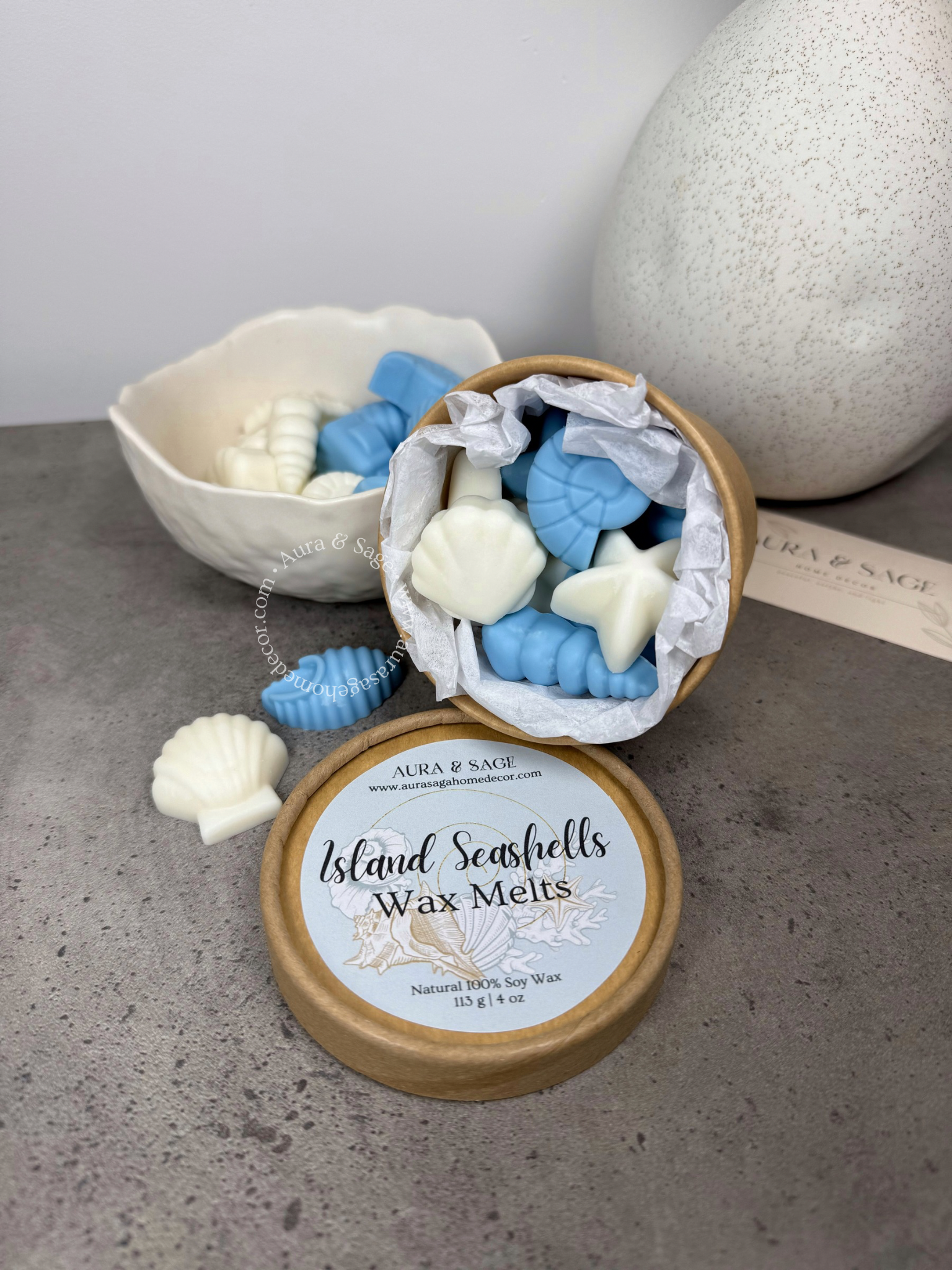 Island Seashells Wax Melts in a recyclable  container on a grey surface