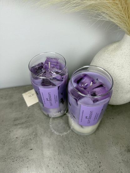 Lavender latte drink-inspired candle in glass container.