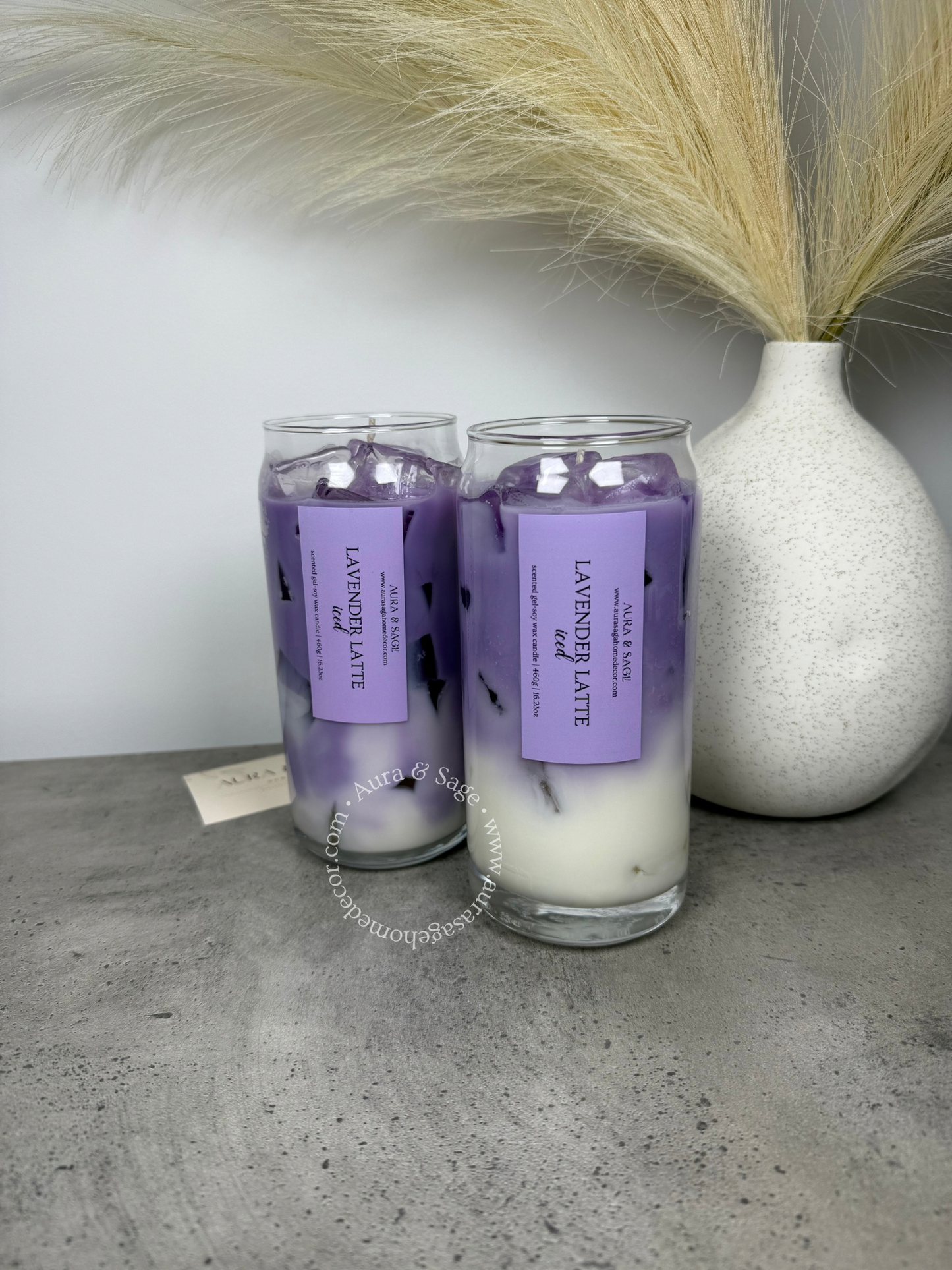 Lavender latte drink-inspired candle in glass container.