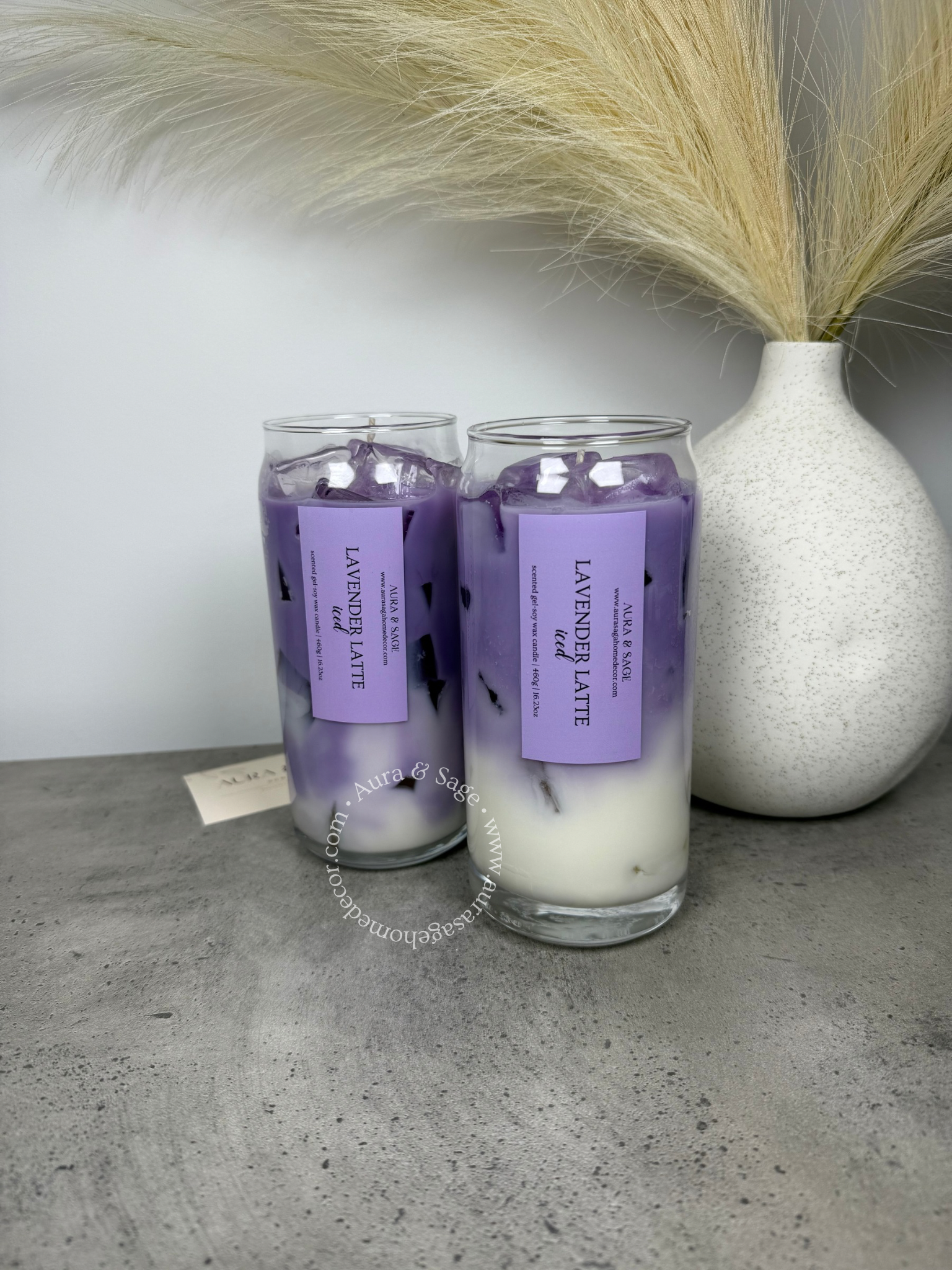 Lavender latte drink-inspired candle in glass container.