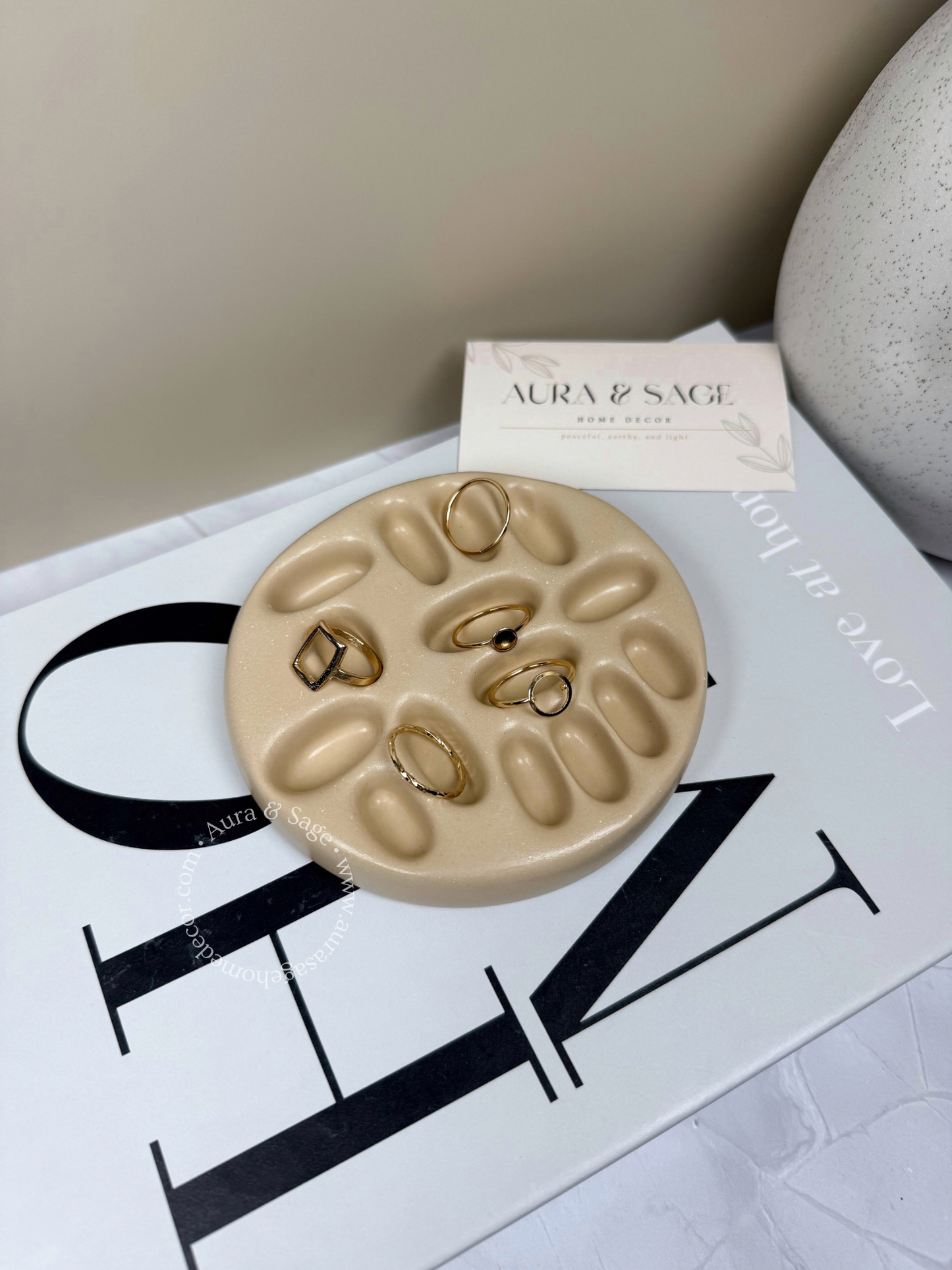 Beige jewelry rings holder.