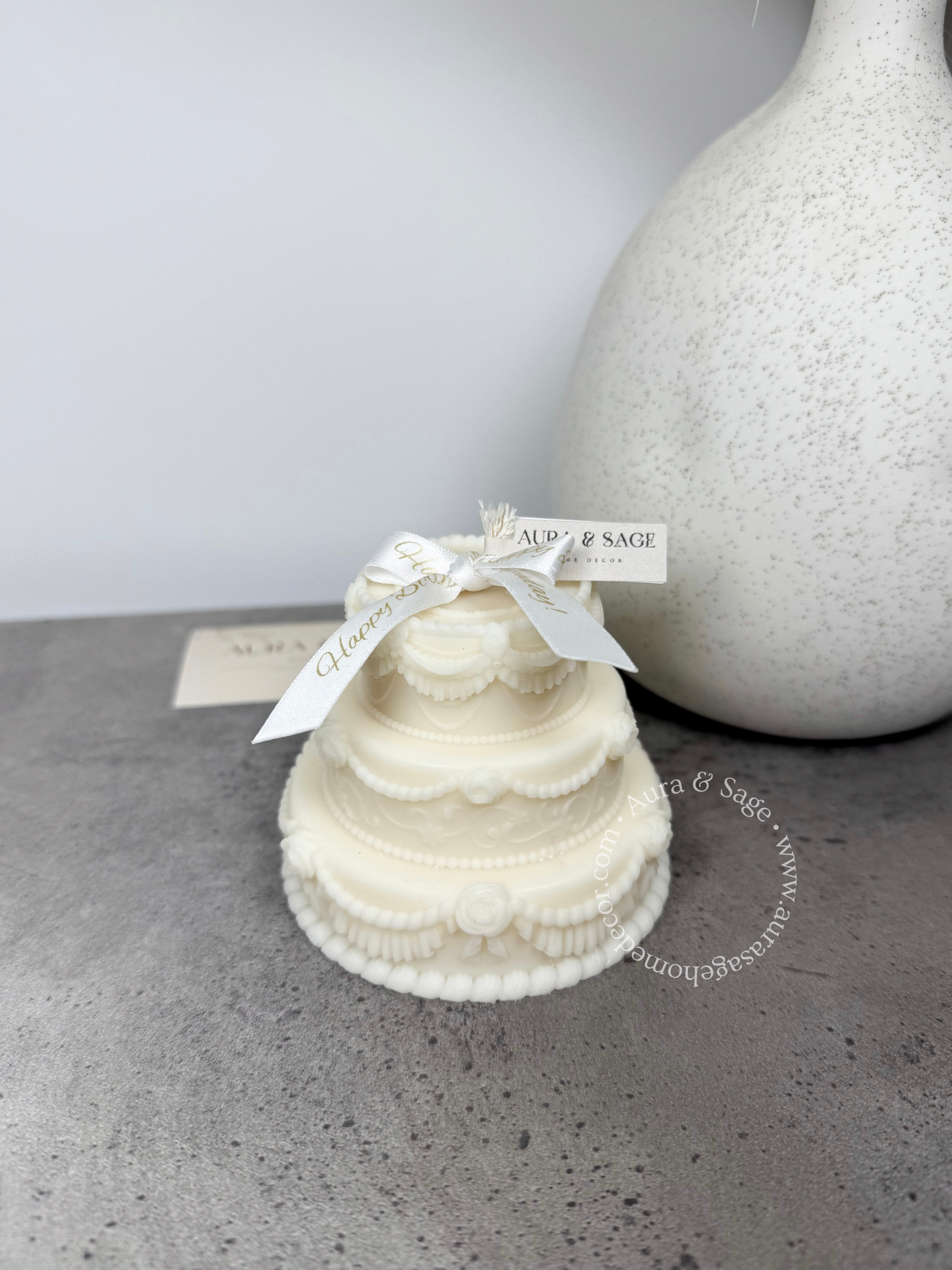 Three tiered cake with white bow, gift idea.