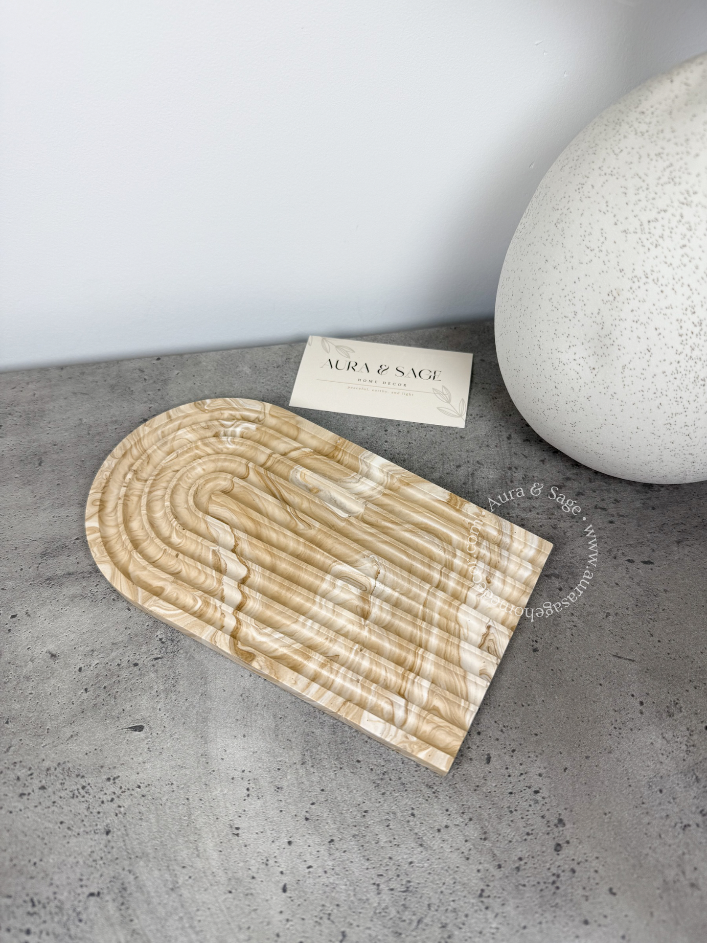 U-shaped textured decorative trinket tray.